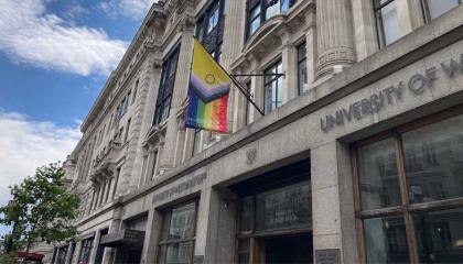 LGBTQ flag flying on Regent Campus facade